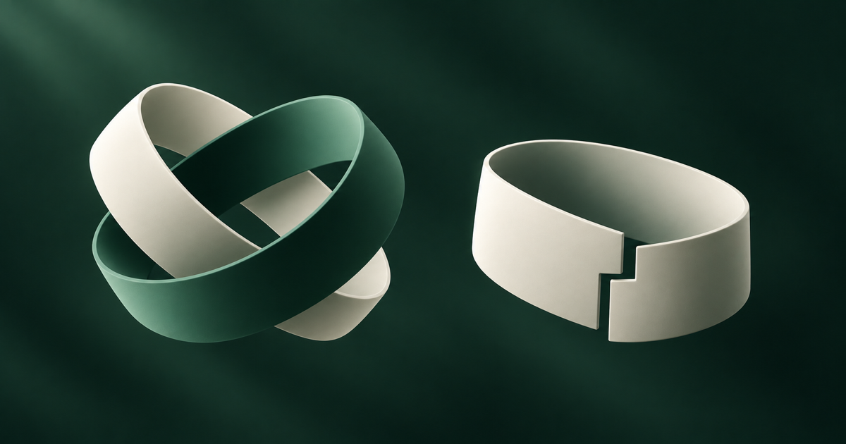 Two contrasting folded-paper sculptures arranged on a dark plinth