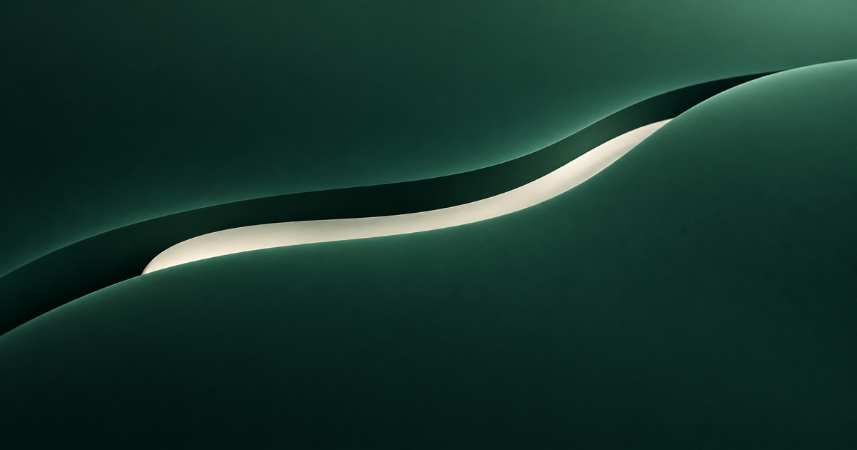 A single handmade-paper strip resting in a quiet curved groove